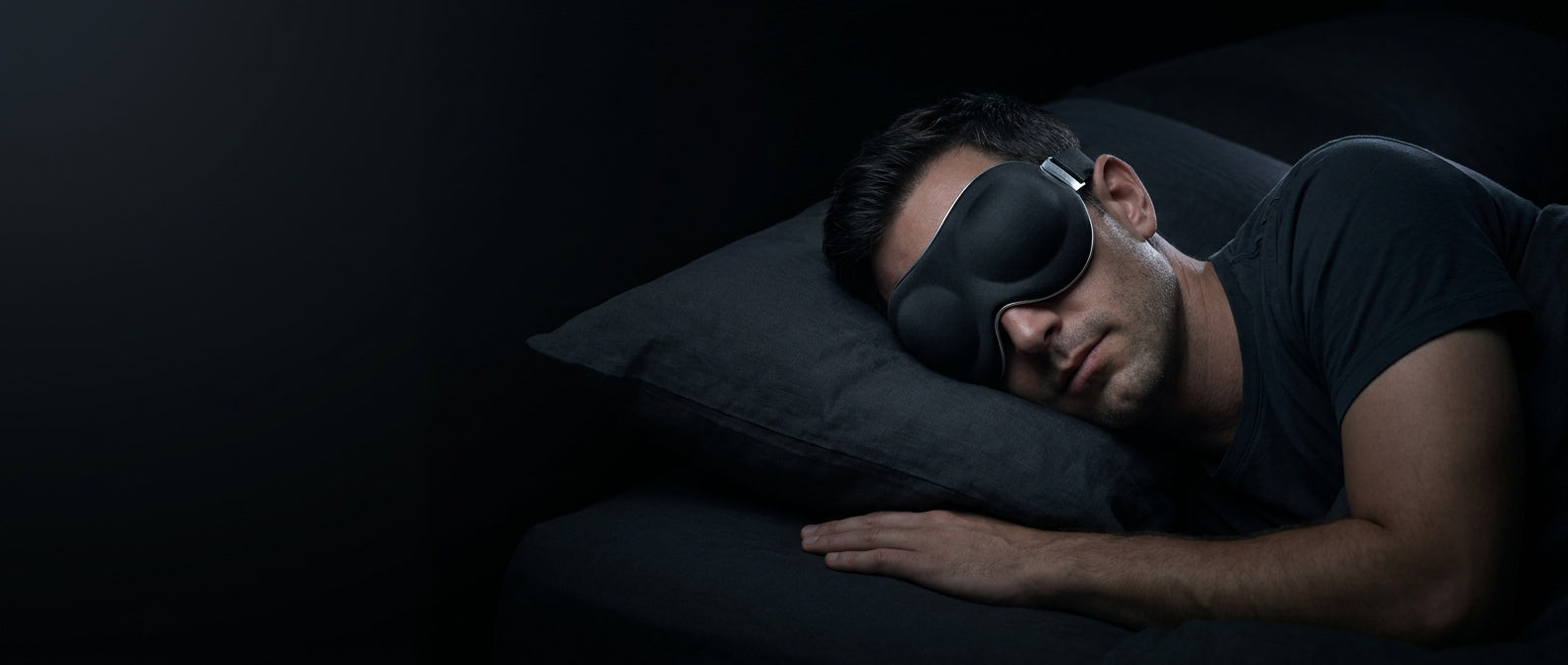 Sleeping in a blackout mask in near-total darkness