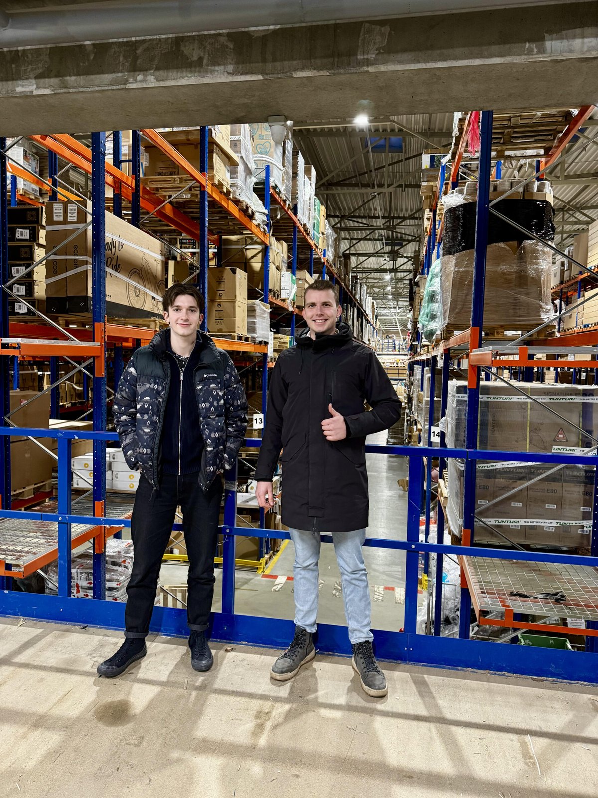 Gustas and Lukas in the warehouse between shipments